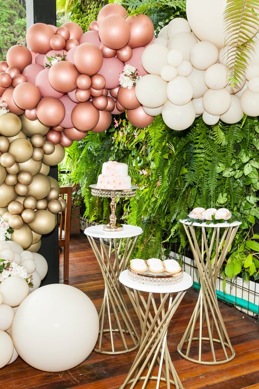 Place decorated with balloon arch, sweets and cake for reception - candy table.